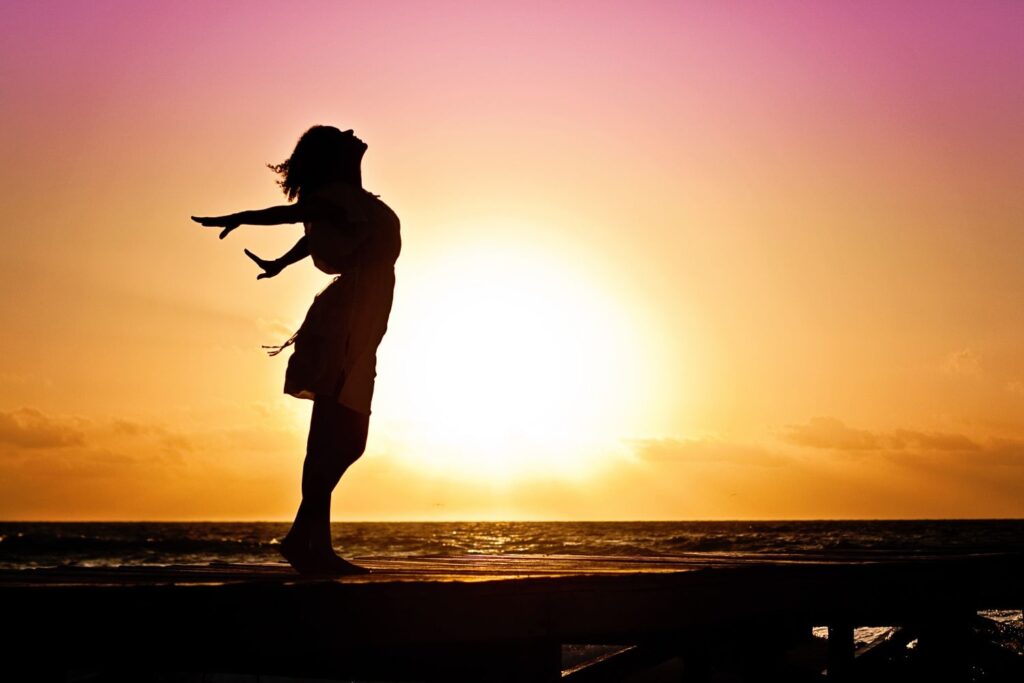silhouette of woman at sunset