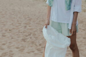 picking up trash on the beach